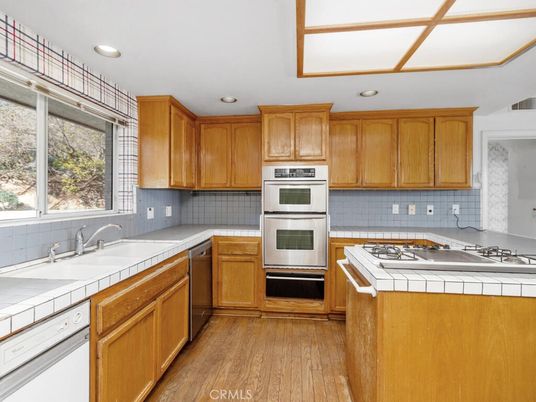 Interior, Kitchen, Recessed Lighting, Stainless Steel Appliances, Tile Countertops, Wood Texture Flooring