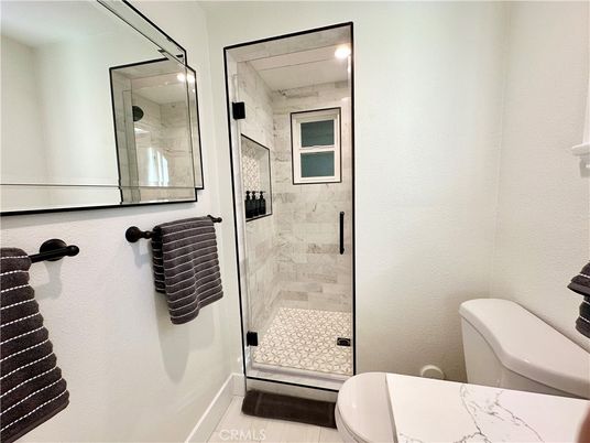 Bathroom, Glass Shower, Interior, Marble Walls, Wood Texture Flooring