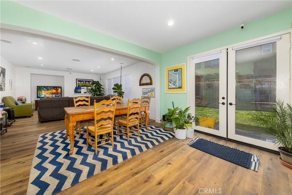 Dining room, Fireplace, Interior, Living room, Recessed Lighting, Wood Texture Flooring