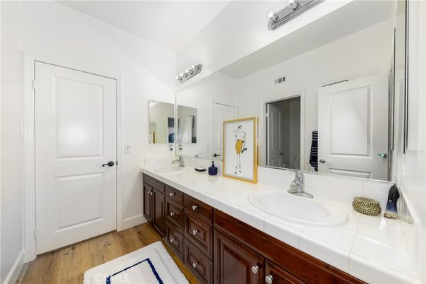 Bathroom, Dual Sink Vanities, Interior, Tile Countertops, Wood Texture Flooring