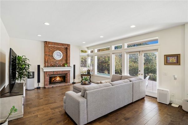 Fireplace, Interior, Living room, Recessed Lighting, Stone Walls, Wood Texture Flooring