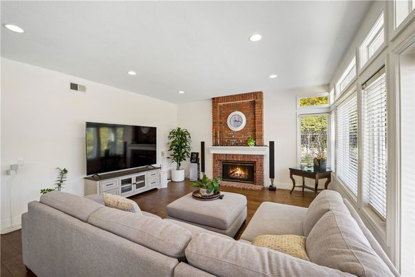 Fireplace, Interior, Living room, Recessed Lighting, Stone Walls, Wood Texture Flooring