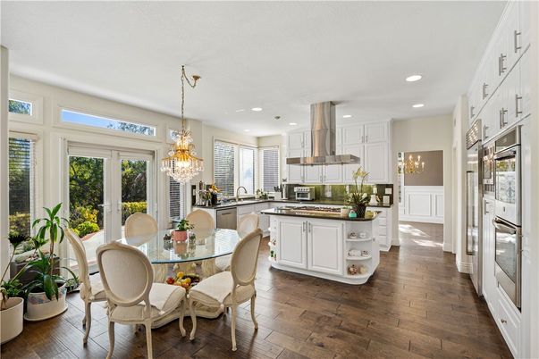Chandelier, Dining room, Interior, Kitchen, Recessed Lighting, Stainless Steel Appliances, Wood Texture Flooring