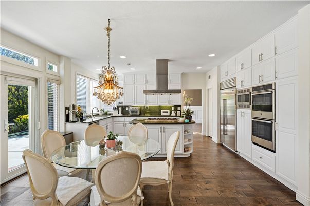 Chandelier, Dining room, Interior, Kitchen, Recessed Lighting, Stainless Steel Appliances, Wood Texture Flooring