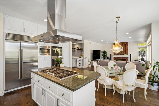 Chandelier, Dining room, Interior, Kitchen, Recessed Lighting, Stainless Steel Appliances, Wood Texture Flooring