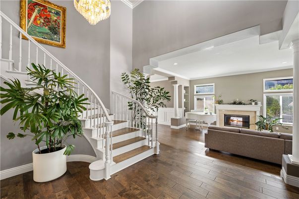 Chandelier, Fireplace, Interior, Living room, Recessed Lighting, Wood Texture Flooring