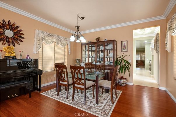 Dining room, Interior, Pendant Lights, Piano, Wood Texture Flooring