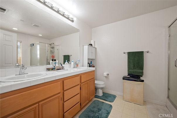 Bathroom, Dual Sink Vanities, Glass Shower, Interior, Recessed Lighting, Tile Countertops
