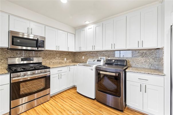 Interior, Kitchen, Recessed Lighting, Stainless Steel Appliances, Washer, Wood Texture Flooring