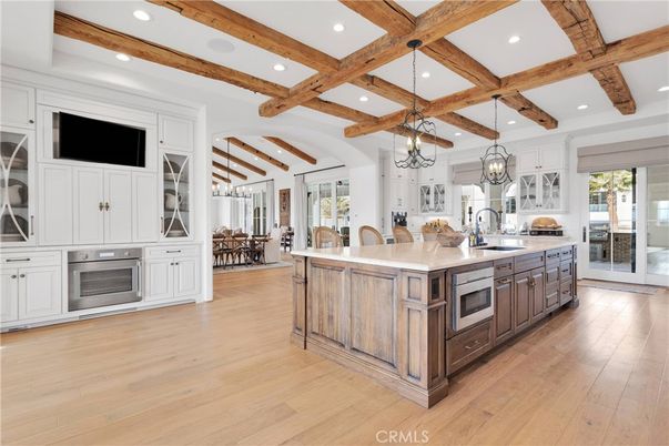 Chandelier, Dining room, Interior, Kitchen, Recessed Lighting, Stainless Steel Appliances, Wooden Beams, Wood Texture Flooring