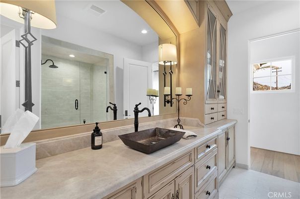 Bathroom, Dual Sink Vanities, Glass Shower, Interior, Recessed Lighting, Tile Countertops, Wood Texture Flooring