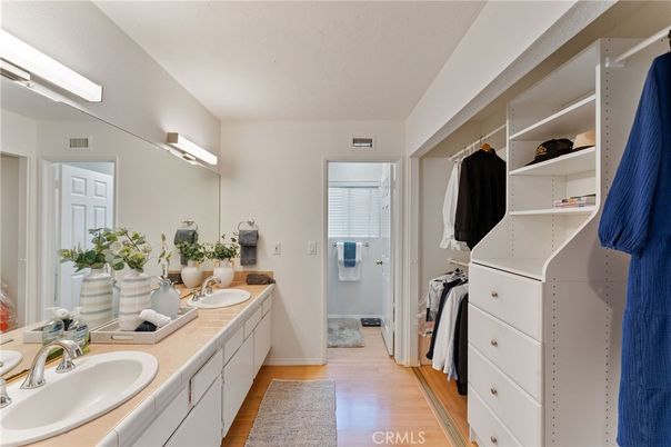 Bathroom, Dual Sink Vanities, Interior, Tile Countertops, Walk-in Closets, Wood Texture Flooring