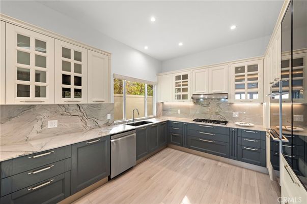 Interior, Kitchen, Marble Walls, Recessed Lighting, Stainless Steel Appliances, Wood Texture Flooring