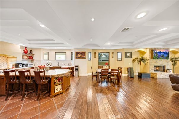 Dining room, Fireplace, Interior, Kitchen, Recessed Lighting, Wood Texture Flooring