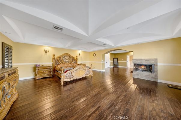 Bedroom, Fireplace, Interior, Recessed Lighting, Wood Texture Flooring