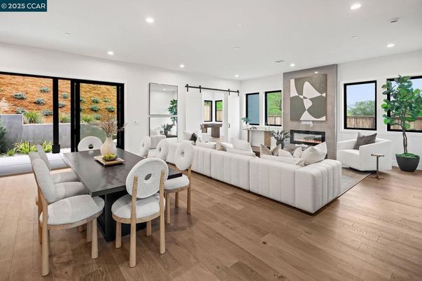 Dining room, Fireplace, Interior, Living room, Recessed Lighting, Wood Texture Flooring