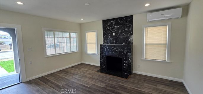 Fireplace, Interior, Marble Walls, Recessed Lighting, Wood Texture Flooring