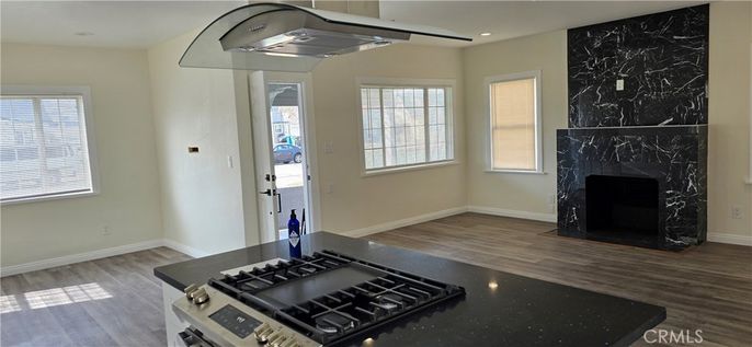 Fireplace, Interior, Kitchen, Marble Walls, Recessed Lighting, Wood Texture Flooring