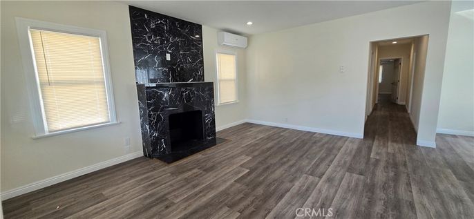 Empty room, Fireplace, Interior, Marble Walls, Recessed Lighting, Wood Texture Flooring
