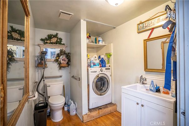 Bathroom, Interior, Utility Closets, Washer, Wood Texture Flooring