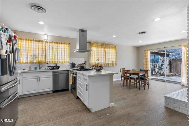 Dining room, Interior, Kitchen, Recessed Lighting, Stainless Steel Appliances, Wood Texture Flooring