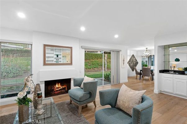 Chandelier, Dining room, Fireplace, Interior, Living room, Recessed Lighting, Wood Texture Flooring