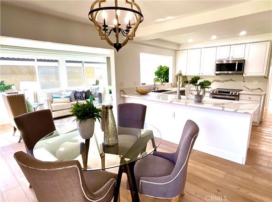 Chandelier, Dining room, Interior, Kitchen, Living room, Recessed Lighting, Stainless Steel Appliances, Wood Texture Flooring