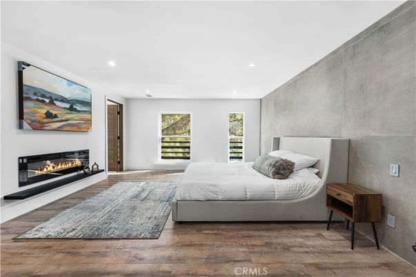 Bedroom, Fireplace, Interior, Recessed Lighting, Wood Texture Flooring