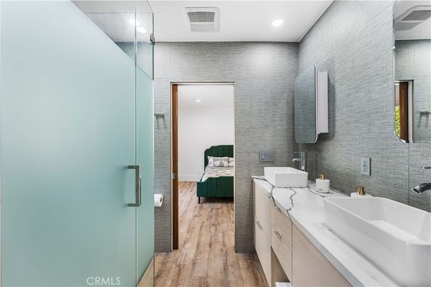 Bathroom, Bedroom, Dual Sink Vanities, Glass Shower, Interior, Recessed Lighting, Wood Texture Flooring