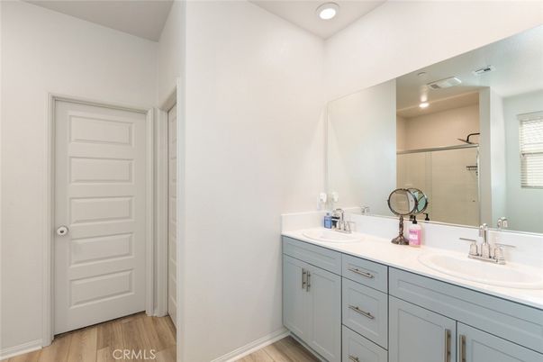 Bathroom, Dual Sink Vanities, Interior, Recessed Lighting, Wood Texture Flooring