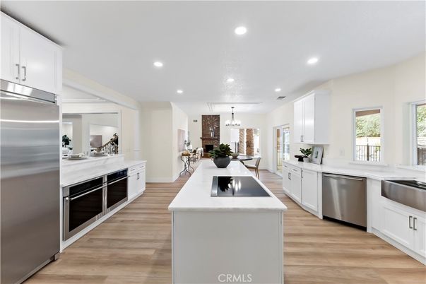 Dining room, Interior, Kitchen, Pendant Lights, Recessed Lighting, Stainless Steel Appliances, Wood Texture Flooring