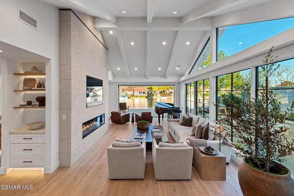 Fireplace, Interior, Living room, Piano, Recessed Lighting, Water, Wood Texture Flooring