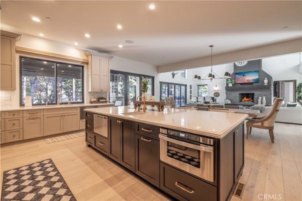 Dining room, Fireplace, Interior, Kitchen, Living room, Pendant Lights, Recessed Lighting, Stainless Steel Appliances, Wood Texture Flooring