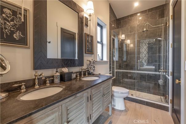 Bathroom, Dual Sink Vanities, Glass Shower, Interior, Recessed Lighting, Wood Texture Flooring