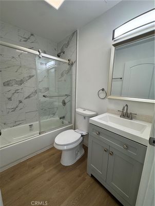 Bathroom, Glass Shower, Interior, Marble Walls, Wood Texture Flooring