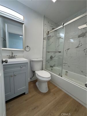 Bathroom, Glass Shower, Interior, Marble Walls, Wood Texture Flooring