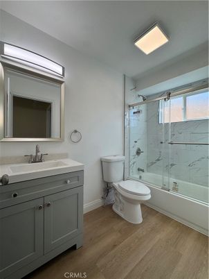 Bathroom, Glass Shower, Interior, Marble Walls, Recessed Lighting, Wood Texture Flooring