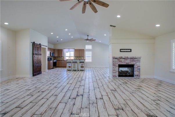 Empty room, Fireplace, Interior, Kitchen, Recessed Lighting, Wood Texture Flooring