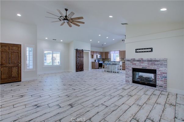 Empty room, Fireplace, Interior, Kitchen, Pendant Lights, Recessed Lighting, Wood Texture Flooring