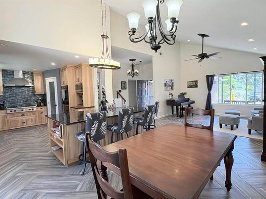 Chandelier, Dining room, Interior, Kitchen, Living room, Pendant Lights, Recessed Lighting, Stainless Steel Appliances, Wood Texture Flooring