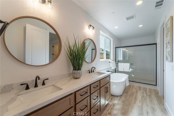 Bathroom, Dual Sink Vanities, Free Standing Baths, Glass Shower, Interior, Recessed Lighting, Wood Texture Flooring