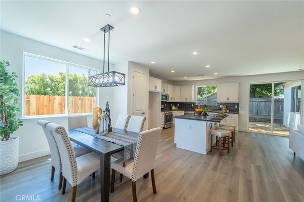 Dining room, Interior, Kitchen, Pendant Lights, Recessed Lighting, Stainless Steel Appliances, Wood Texture Flooring