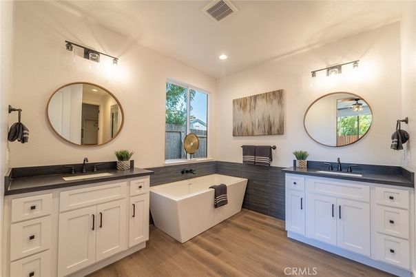 Bathroom, Dual Sink Vanities, Free Standing Baths, Interior, Recessed Lighting, Wood Texture Flooring