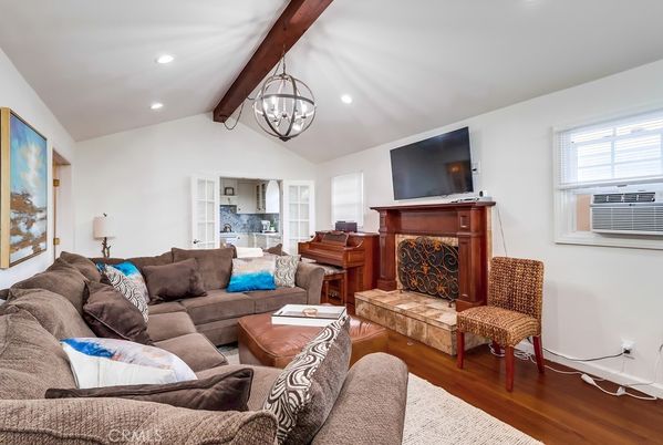 Chandelier, Fireplace, Interior, Living room, Piano, Recessed Lighting, Wooden Beams, Wood Texture Flooring