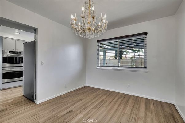 Chandelier, Empty room, Interior, Kitchen, Stainless Steel Appliances, Wood Texture Flooring