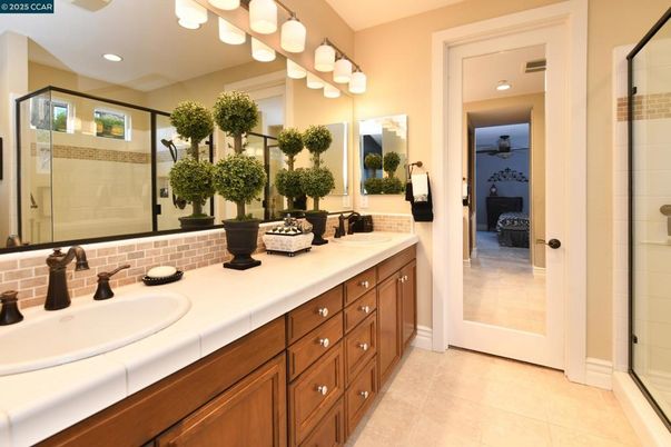 Bathroom, Dual Sink Vanities, Glass Shower, Interior, Recessed Lighting, Tile Countertops