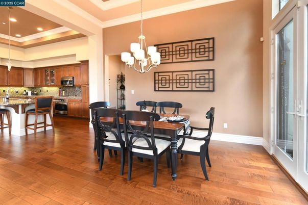 Chandelier, Dining room, Interior, Kitchen, Recessed Lighting, Stainless Steel Appliances, Wood Texture Flooring