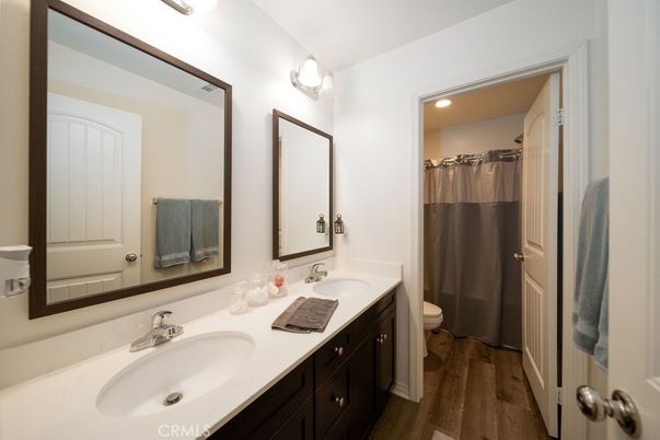 Bathroom, Dual Sink Vanities, Interior, Recessed Lighting, Wood Texture Flooring