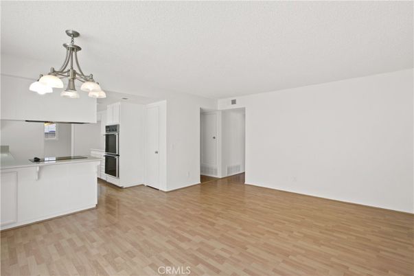 Chandelier, Empty room, Interior, Kitchen, Stainless Steel Appliances, Wood Texture Flooring