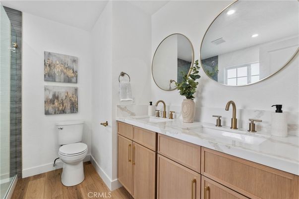 Bathroom, Dual Sink Vanities, Interior, Recessed Lighting, Wood Texture Flooring
